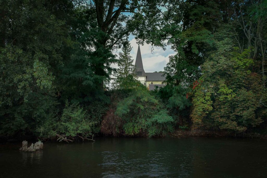 View of the river, vegetation and church
