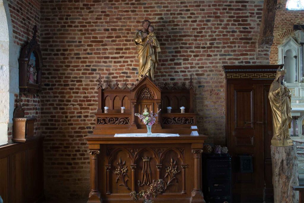 Interior of Plomion church, religious statues