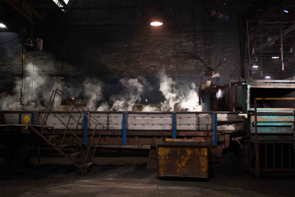 machines in operation, smoke, the foundry of Sougland
